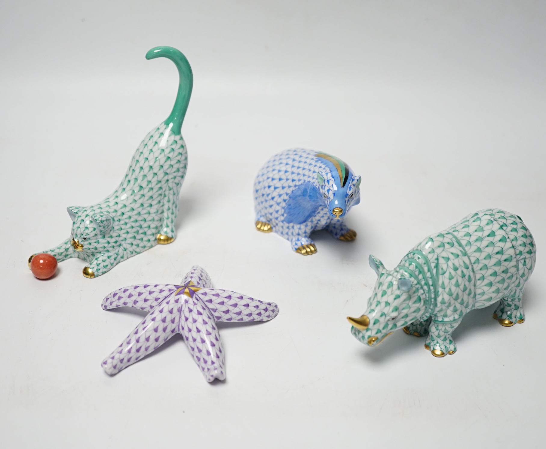 Four Herend models of a cat, badger, hippo and starfish, tallest 13cm high